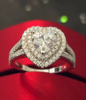 moissanite ring on a red background